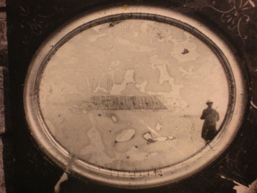 A framed image that historians have long thought might be the only existing photograph of the Confederate ironclad CSS Georgia, which sank 150 years ago near Savannah, Ga. (AP Photo/John Potter)
