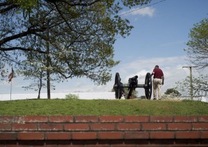 Randy Dalton, Construction Coordinator with Lynchburg City Public Works, helps install a civil war cannon on the front lawn of Fort Early. Photo by Jill Nance