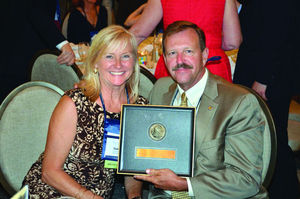 Photos by BRUCE GUTHRIE/CIVIL WAR TRUST Virginia conservation chief Clyde Cristman, with wife Sandy, holds the trust award he accepted on behalf of his boss, Virginia Natural Resources Secretary Molly Ward.