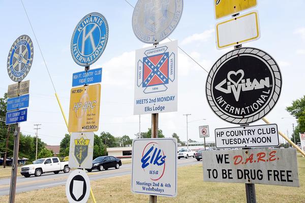 A sign for the Sons of Confederate Veterans, which contains the Confederate battle flag, is part of a group of signs for civic groups along N. Main Street near the bypass for US 311 is shown last week. All of the signs have now been removed.LAURA GREENE | HPE
