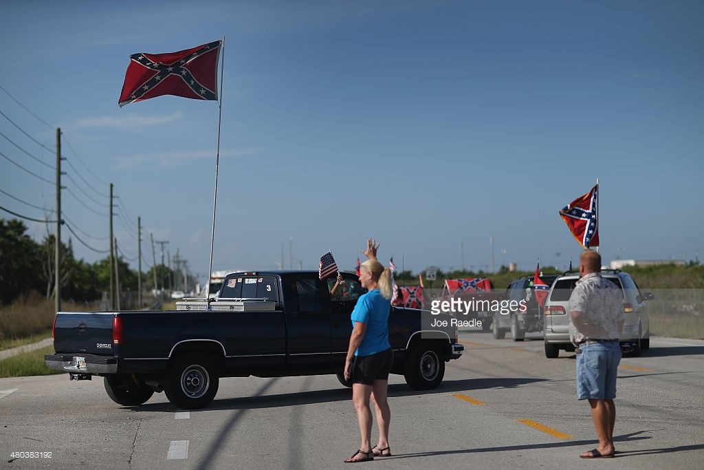 Confederate and American flags fly from trucks during a rally to show support for the flags on July 11, 2015 in Loxahatchee, Florida. Getty Images