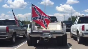 A Confederate flag flown from the back of a pickup at Stewarts Creek High School in Smyrna, Tenn., with the words, "Heritage not Hate" - WKRN-TV