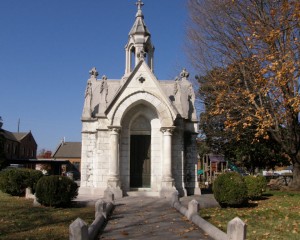 In the burial ground beside St. Luke's Episcopal Church, one of Cleveland's oldest landmarks, is a hauntingly beautiful white marble mausoleum built to hold the remains of a beloved 7-year-old girl. Nina Craigmiles was the daughter of two of Cleveland's most prominent citizens, Adelia and John Henderson Craigmiles. On Oct. 18, 1871 - St. Luke's Day - Nina was riding in a carriage with her grandfather, Dr. Gideon Thompson. For an unknown reason, the carriage was steered in front of an oncoming train; Nina was killed and Dr. Thompson was thrown clear. It is unclear who was driving the buggy. Thompson was known to let Nina take the reins at times. Nina's family was devastated by her loss. John Craigmiles used his substantial fortune to create a lasting memorial: a stately church and beautiful mausoleum and tomb. No expense was spared. (Source: Roadrunner via RoadsideWonders.net)