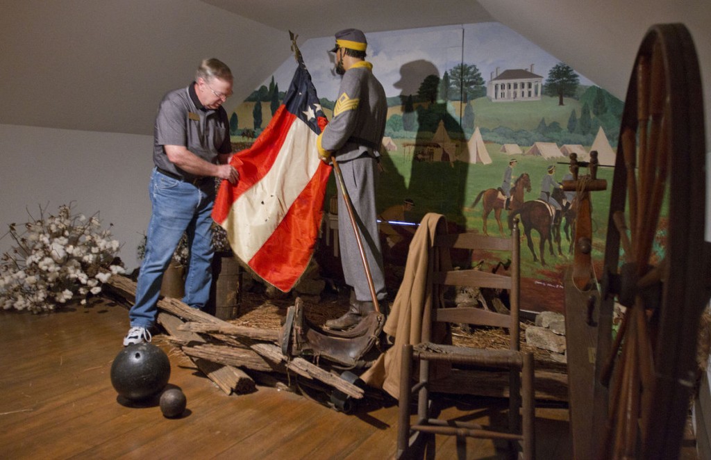 Pope's tavern curator Wayne Higgins checks the condition of a relic. 