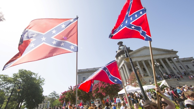 The Confederate flag, removed from public grounds in South Carolina in 2015, is a widely-reviled symbol, but still has its supporters. The design was featured on merchandise at 2016's Norfolk County Fair. (Jason Miczek/Reuters)