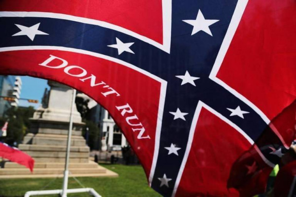 The S.C. Secessionist Party will mark the two-year anniversary of the Confederate flag coming down from the State House by raising the banner again on a temporary pole Monday. Pictured is last year’s event, which drew around 150 people. File photo by Gerry Melendez